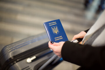 Prague, Czech republic - November 21, 2024: Ukrainian Biometric Passport in Female Hand 