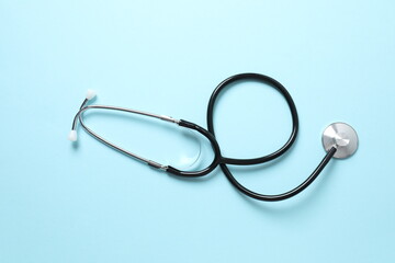 Fototapeta premium Stethoscope on color background, top view