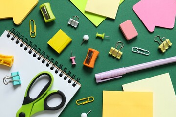 Flat lay with school stationery on wooden background, top view