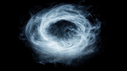 Abstract swirling smoke ring isolated on a black background.