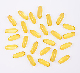 Omega 3 tablets isolated on white background . yellow pills close up. Fish oil capsules. Golden vitamin D3