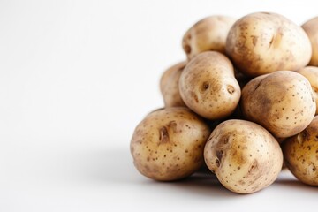 Close up of potatoes on white background.