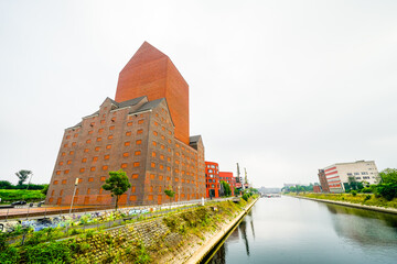 View of the surrounding area at the harbor in Duisburg. Industrial port on the Ruhr. Building of...