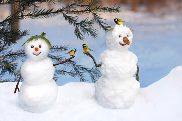Young and funny old snowman with tit birds for calendar or New Year's card.