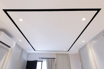 The minimalist living room ceiling is rectangular in shape with a white base and black trim