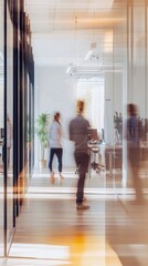 Bright modern office space with blurred movement and casual attire