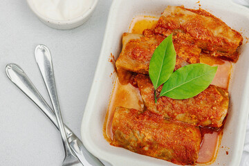 Cabbage rolls stuffed with rice and meat stewed in tomato sauce. Traditional dish, ready-to-eat food