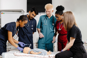 Group of doctors surrounding baby for medical examination