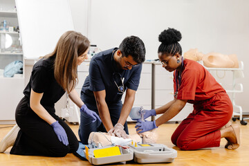 Healthcare professionals in scrubs performing medical procedure