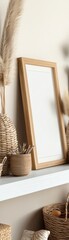 Cozy minimalistic interior with wicker baskets, pampas grass, and an empty wooden frame.