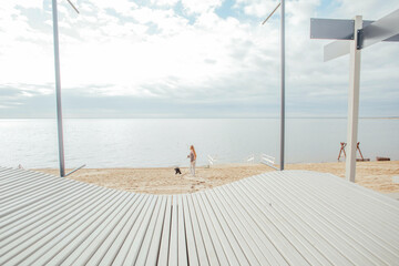 Red-haired girl with a dog, rest on wellness retreats