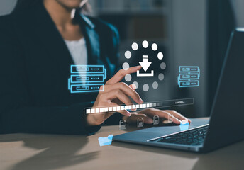 Businesswoman checking data transfer using laptop computer with server storage icon for data...