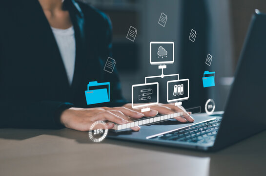 Businesswoman checking data transfer using laptop computer with server storage icon for data exchange and transfer concept