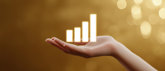 Hand holding glowing bar graph symbolizing success and growth, representing progress and achievement in business