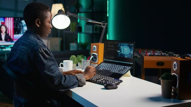 AI expert writes code on laptop in apartment office using Java programming languages. Artificial intelligence programmer remotely working on fixing database errors while working from home, camera B