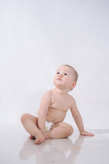 a one-and-a-half-year-old girl on a white background
