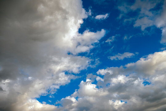 Blue sky with vibrant white clouds during daylight.