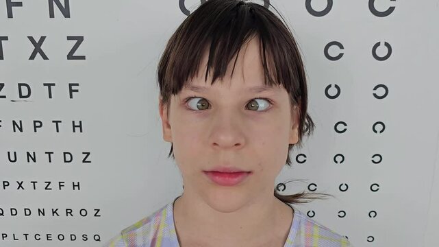 Child face with squint and freckles on nose