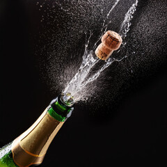 A stunning image beautifully capturing the exact moment a champagne cork pops off, spraying delightful bubbles
