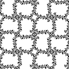 Seamless pattern Black leafy branches on a crisp white background, perfect for textile, wallpaper, or graphic design projects

