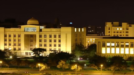 A well-lit building at night, showcasing architectural design and urban landscape.