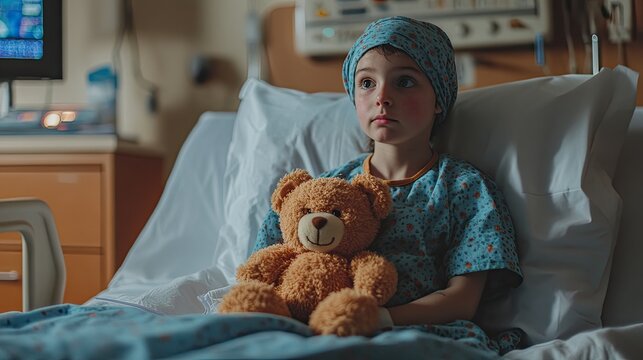 Pediatric patient with a brain tumor sitting in a hospital bed, holding a teddy bear. with copy space