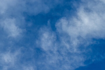 Blue sky and clouds background with lots of copy space.