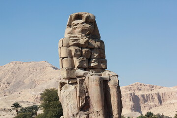 Ancient stone statues of the Pharaoh Amenhotep III in west Luxor, Egypt.