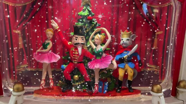 A beautifully designed magical Christmas scene featuring a charming Nutcracker and graceful dancers