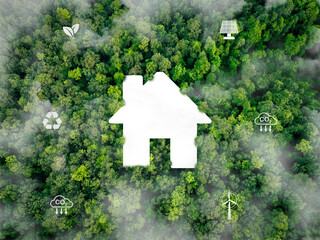 Sustainable home with renewable energy sources. Wind turbines and solar panels providing...