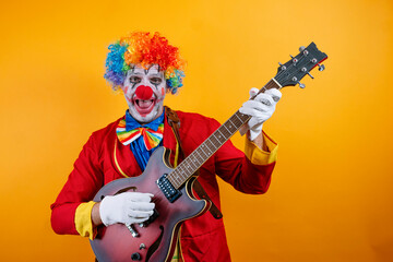 Obraz premium Rock 'n' roll clown plays electric guitar