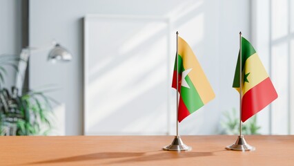 FLAGS OF MYANMAR AND SENEGAL ON TABLE