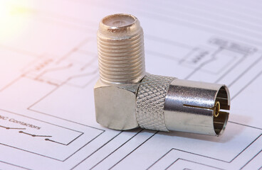 Metal F-connectors for connecting coaxial cable. Close-up. Soft focus.Sunflare. 