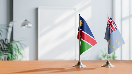 FLAGS OF NAMIBIA AND TUVALU ON TABLE
