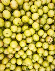 Beautiful fresh green Indian gooseberry or Amla is full of vitamin healthy and organic fruits portrait image  