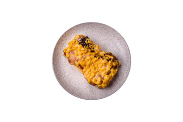 Sandwich with brioche, meat, melted cheese, corn, salt, spices and herbs