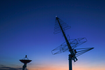 Astronomical telescope equipment, silhouette at sunset