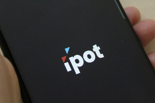 IPOT app logo display on a smartphone. IPOT app by Indo Premier Investment from Indonesia