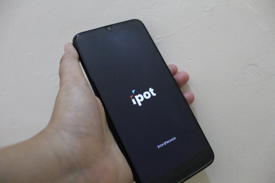 IPOT app logo display on a smartphone. IPOT app by Indo Premier Investment from Indonesia