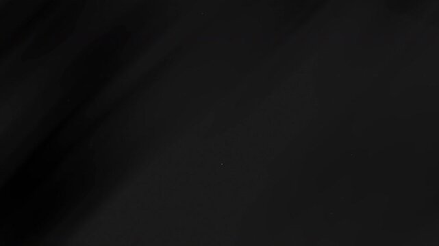Dark black with subtle shading and texture, suitable for background