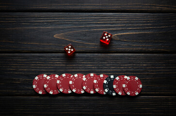 Chips and dice on a vintage table in a gentlemen's club after a successful game of craps. Low key...