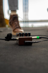 Close up shot of electric guitar pedal on stage during a concert