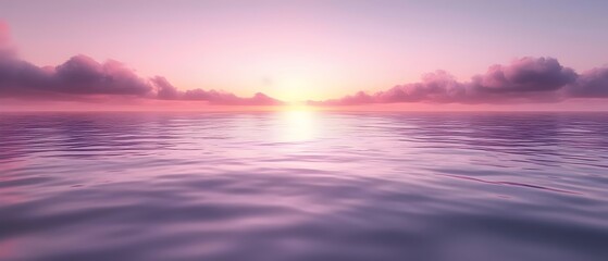 Obraz premium A serene sunrise over a calm ocean, featuring soft pink and purple hues reflecting on the water's surface, creating a tranquil and peaceful atmosphere.
