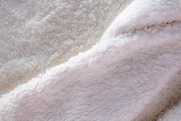 close-up of wool with a fluffy texture, the focus is on the intricate fibers, highlighting its warmth and comfort