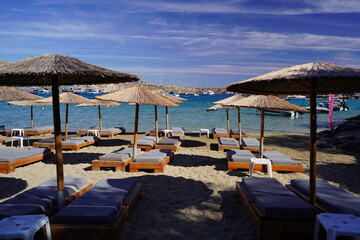 lounge beds and sunshades on Lindos bay sandy beach