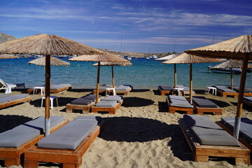 lounge beds and sunshades on Lindos bay sandy beach