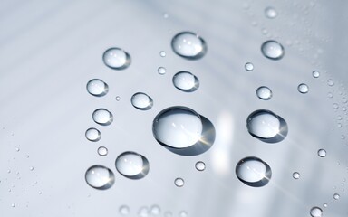 water droplets on a car surface with the reflection of them.