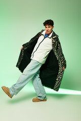 Confident person showcases unique style in a vibrant studio, posing in trendy outfits.
