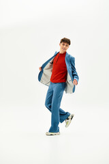 Charismatic person strikes a playful pose in a trendy outfit, radiating confidence.