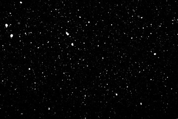 Real falling snow texture isolated on black background